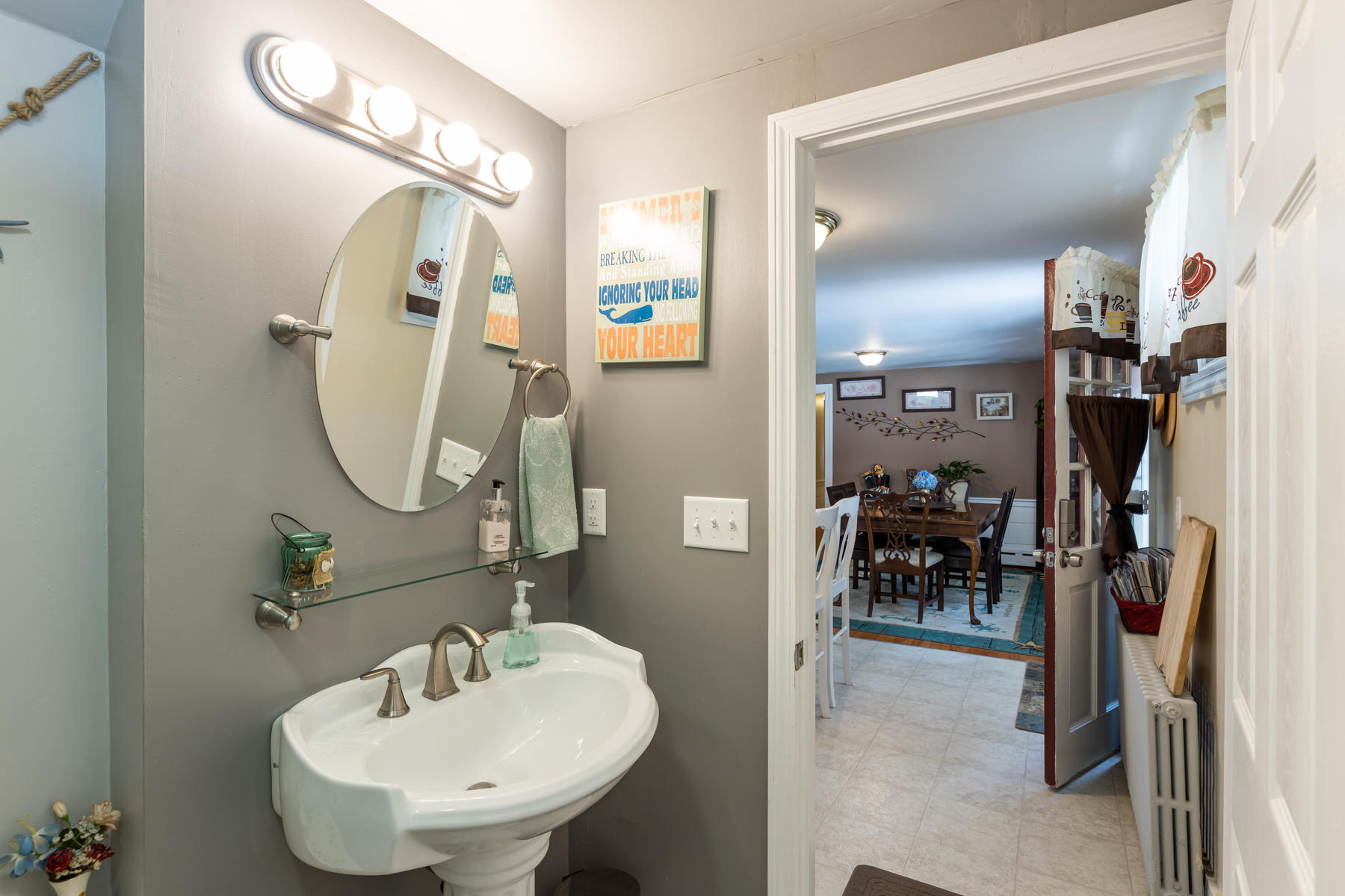 64 Murphy Road Hyannis, MA 02601 - Photo 21 of 64 a bathroom with a sink and mirror with toilet
