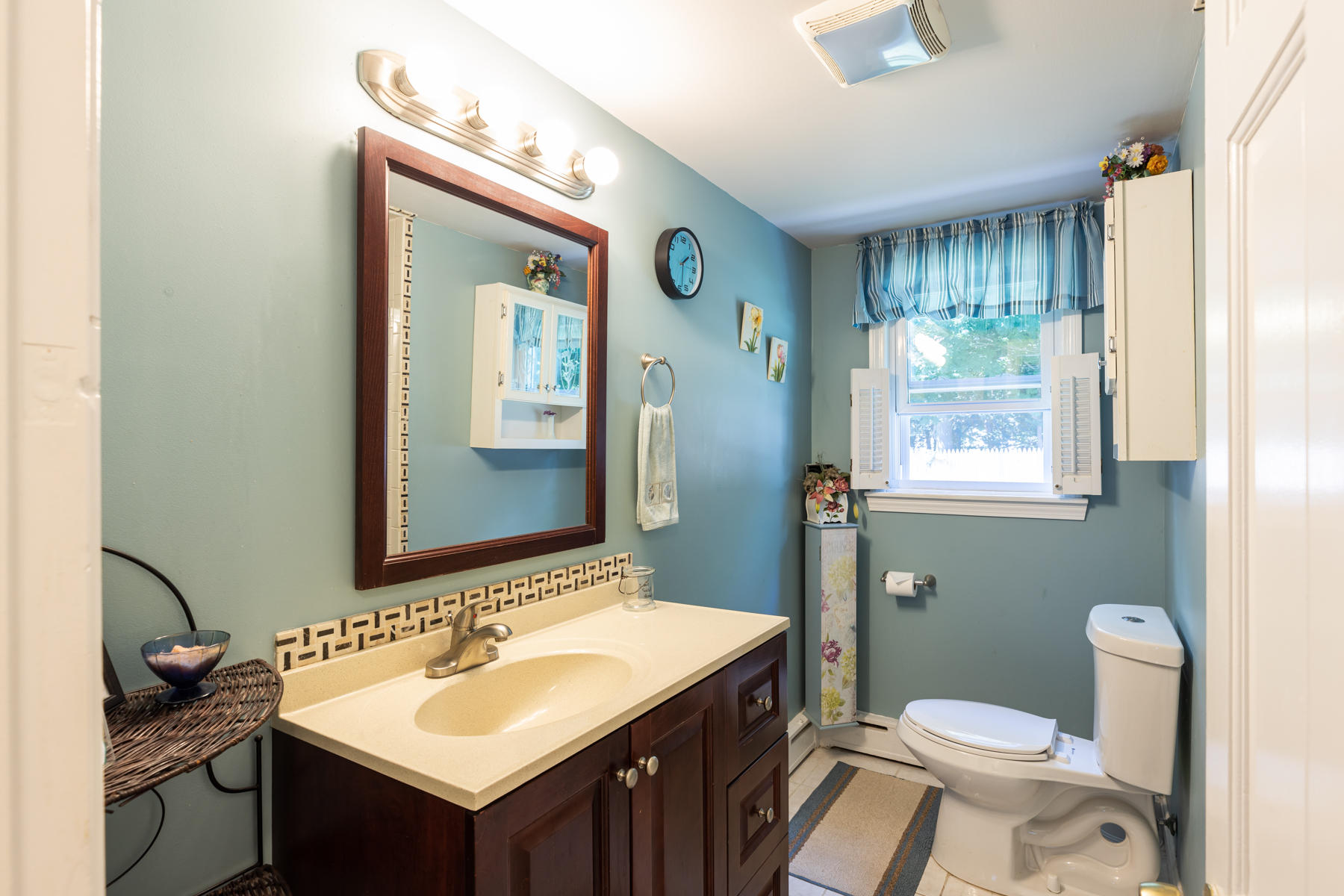 64 Murphy Road Hyannis, MA 02601 - Photo 28 of 64 a bathroom with a granite countertop sink toilet and mirror
