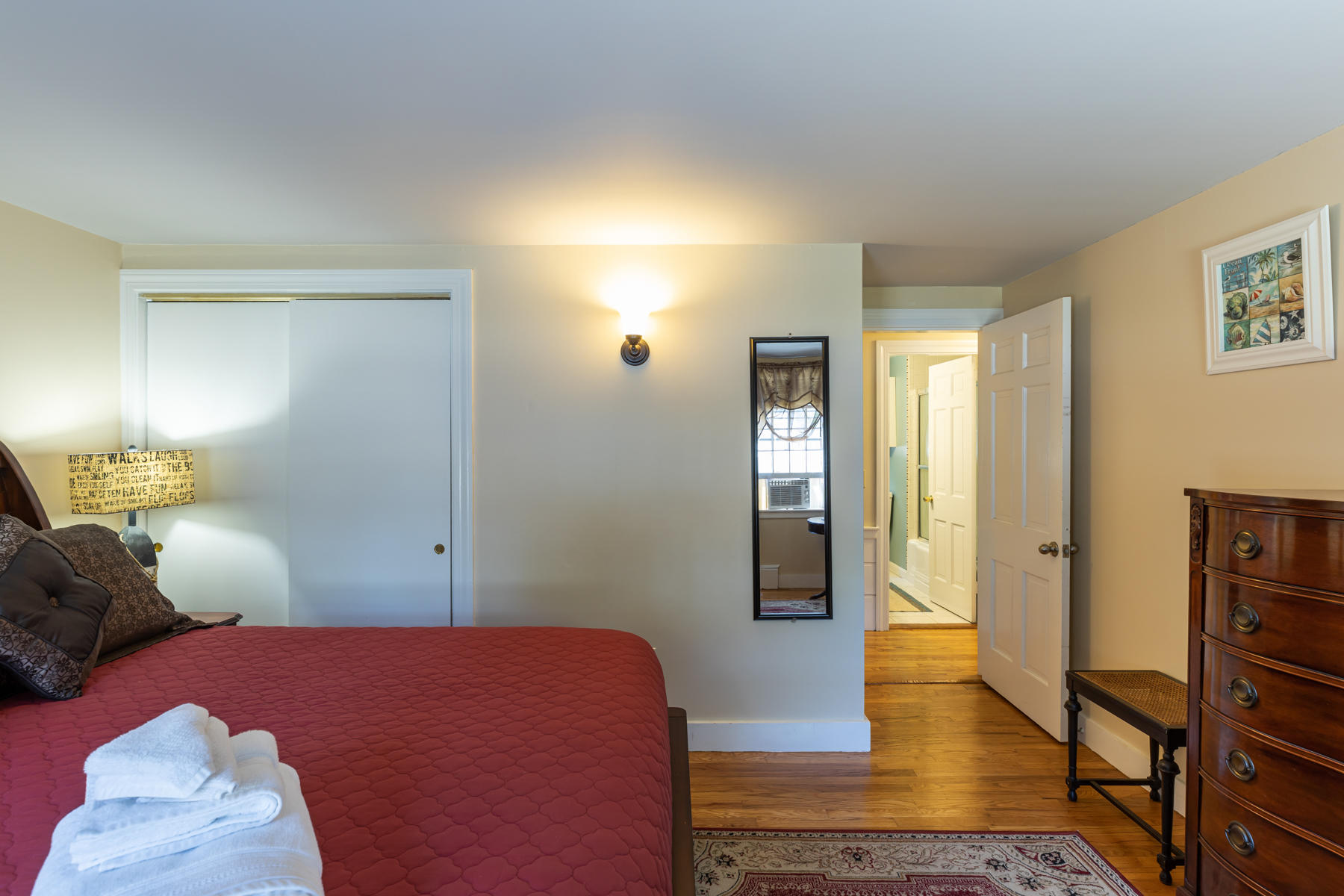 64 Murphy Road Hyannis, MA 02601 - Photo 32 of 64 a bedroom with a bed and wooden floor