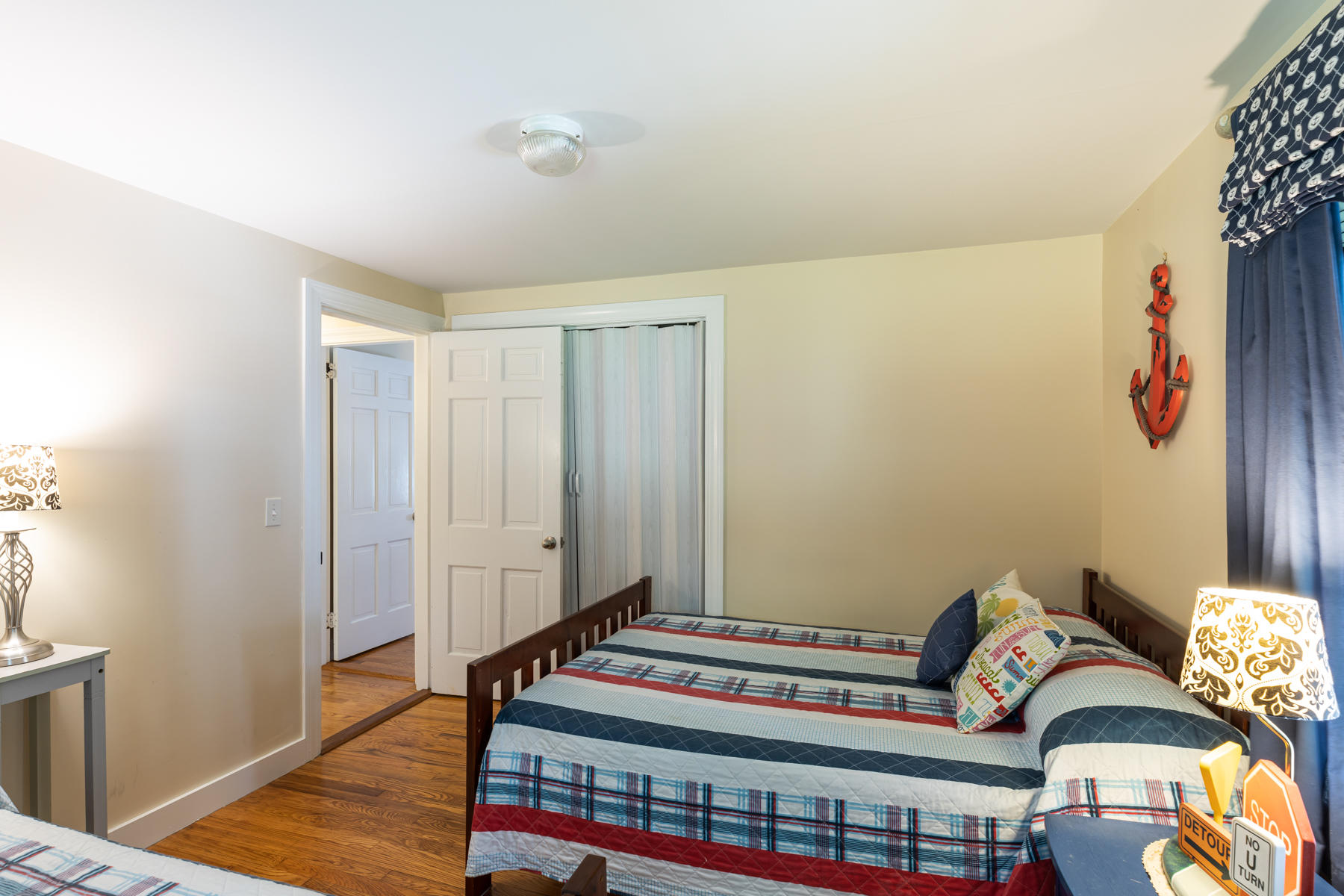 64 Murphy Road Hyannis, MA 02601 - Photo 34 of 64 a bedroom with a bed and wooden floor