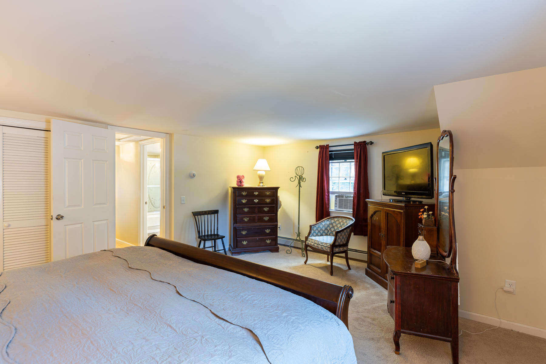 64 Murphy Road Hyannis, MA 02601 - Photo 36 of 64 a bedroom with furniture and a fireplace