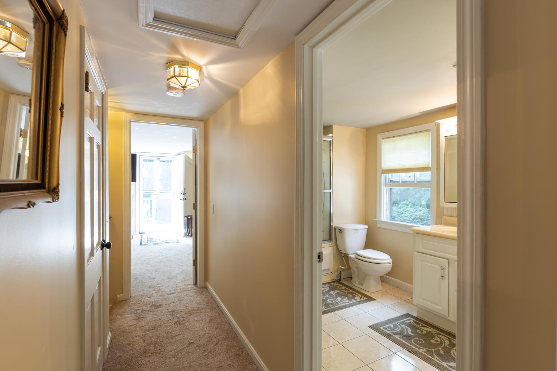 64 Murphy Road Hyannis, MA 02601 - Photo 40 of 64 a bathroom with a granite countertop sink a toilet and a shower
