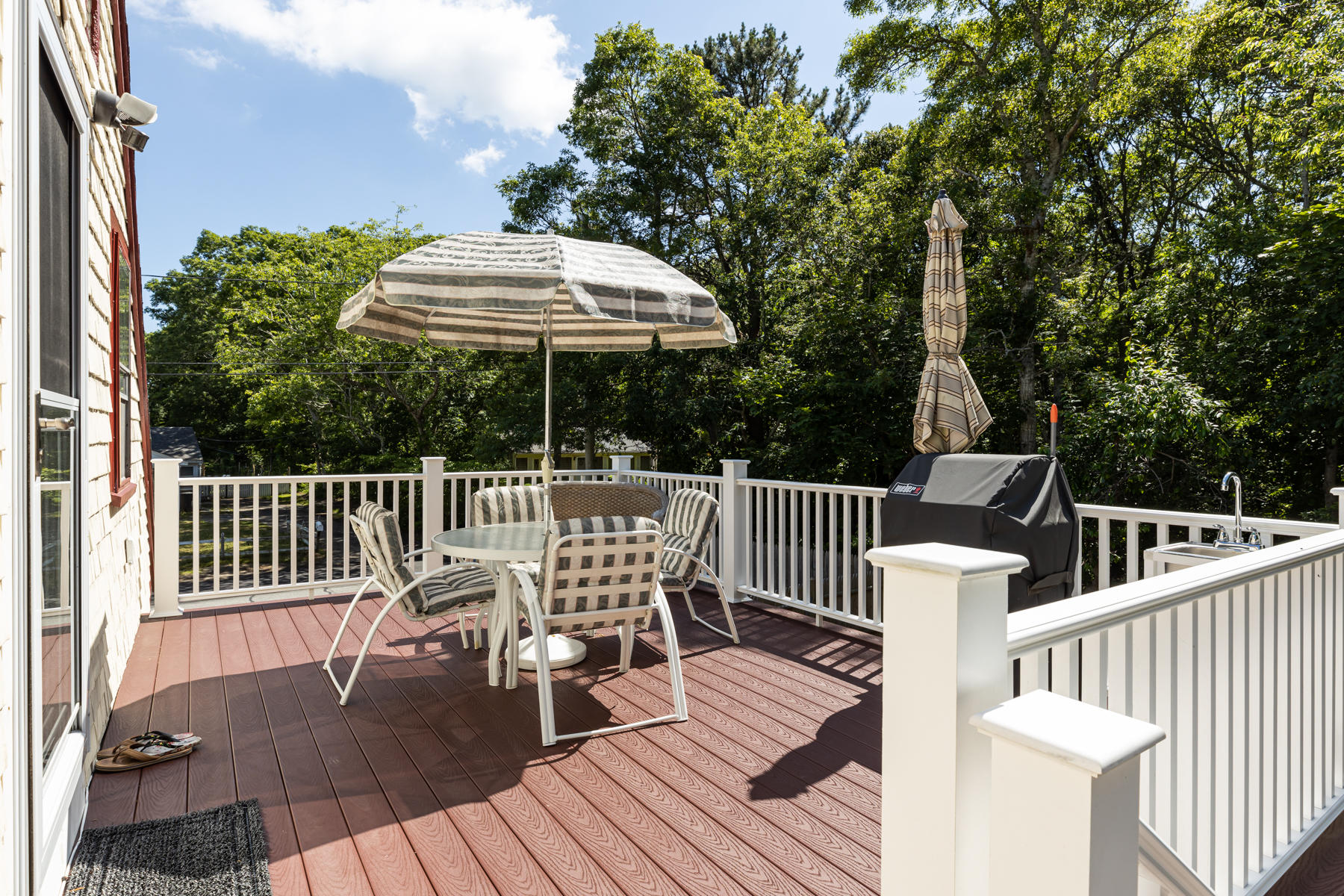 64 Murphy Road Hyannis, MA 02601 - Photo 45 of 64 a view of a chair and table on the deck