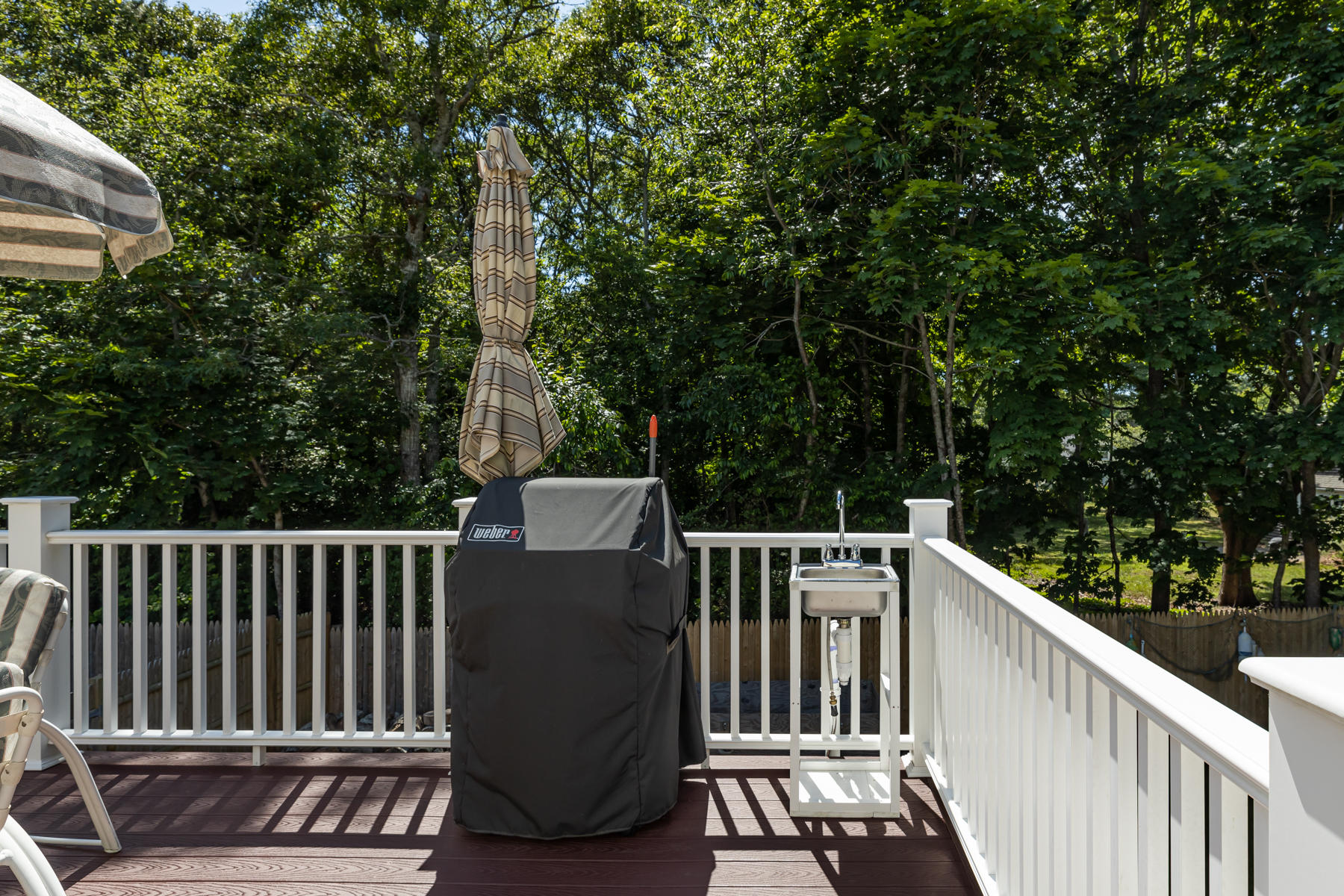 64 Murphy Road Hyannis, MA 02601 - Photo 46 of 64 a view of a roof deck with wooden fence and trees