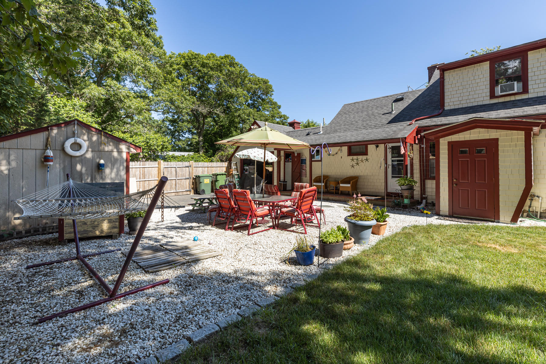 64 Murphy Road Hyannis, MA 02601 - Photo 57 of 64 a view of a house with backyard porch and sitting area