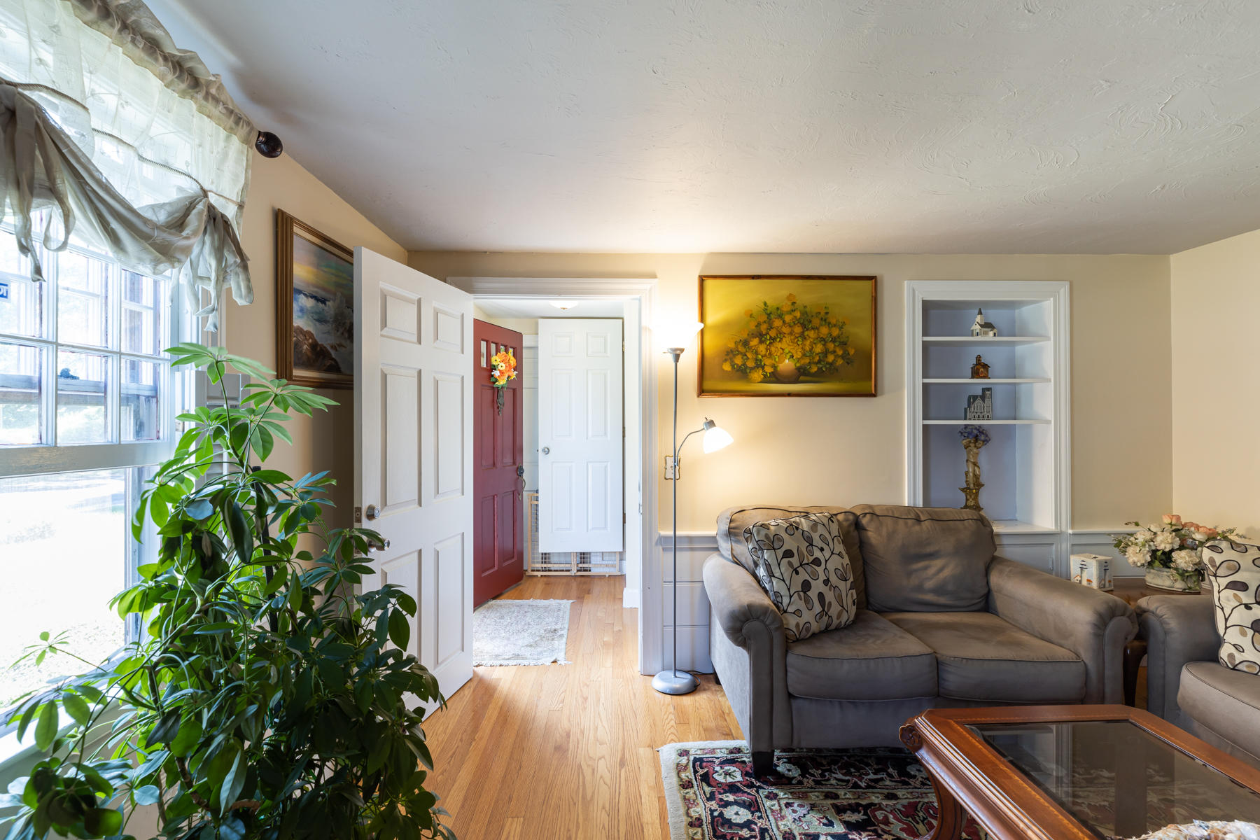 64 Murphy Road Hyannis, MA 02601 - Photo 9 of 64 a living room with furniture and a potted plant