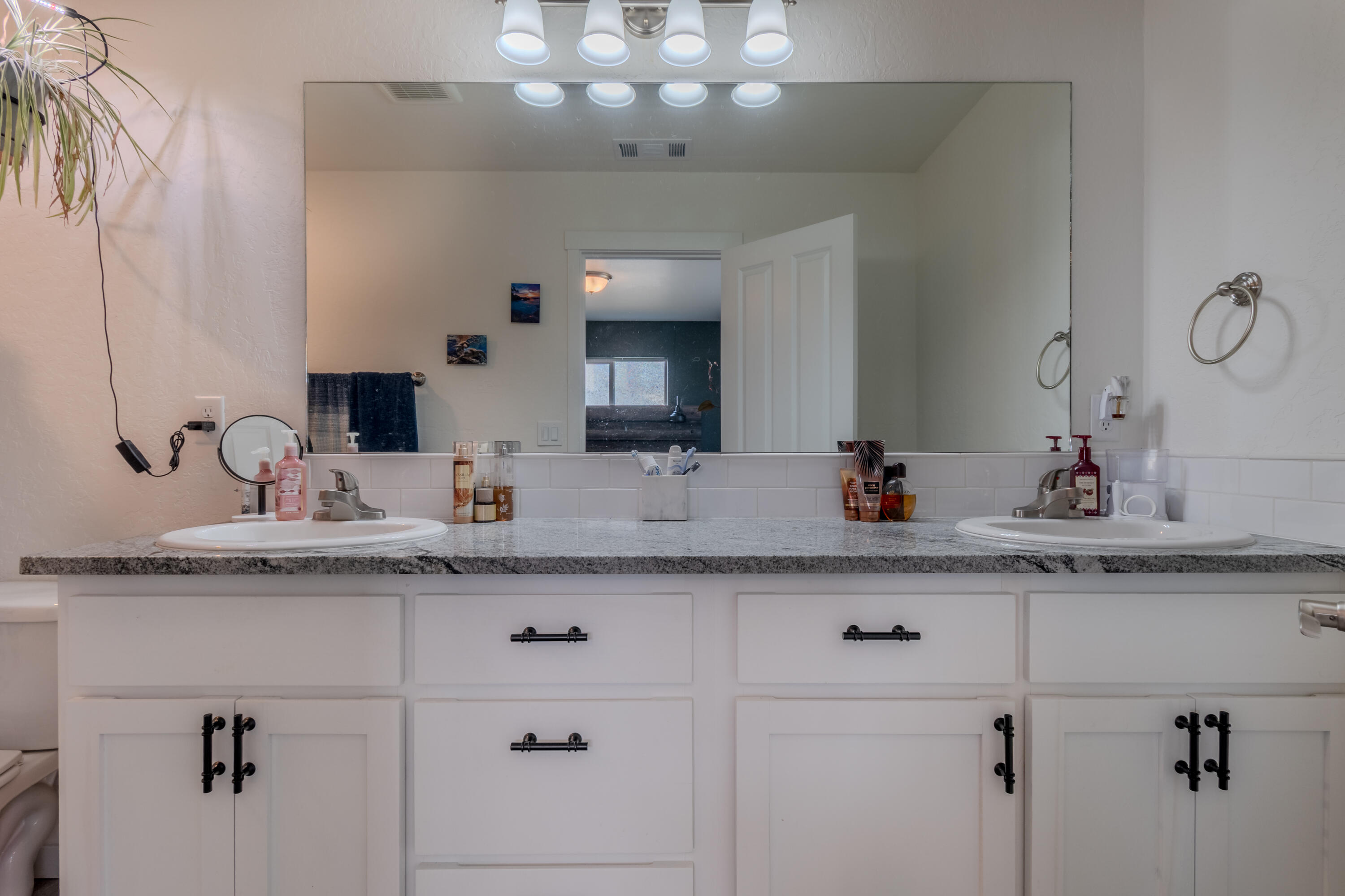 21 Cerulean Terrace Eagle Point, OR 97524 - Photo 20 of 30 a bathroom with a granite countertop sink a mirror and shower