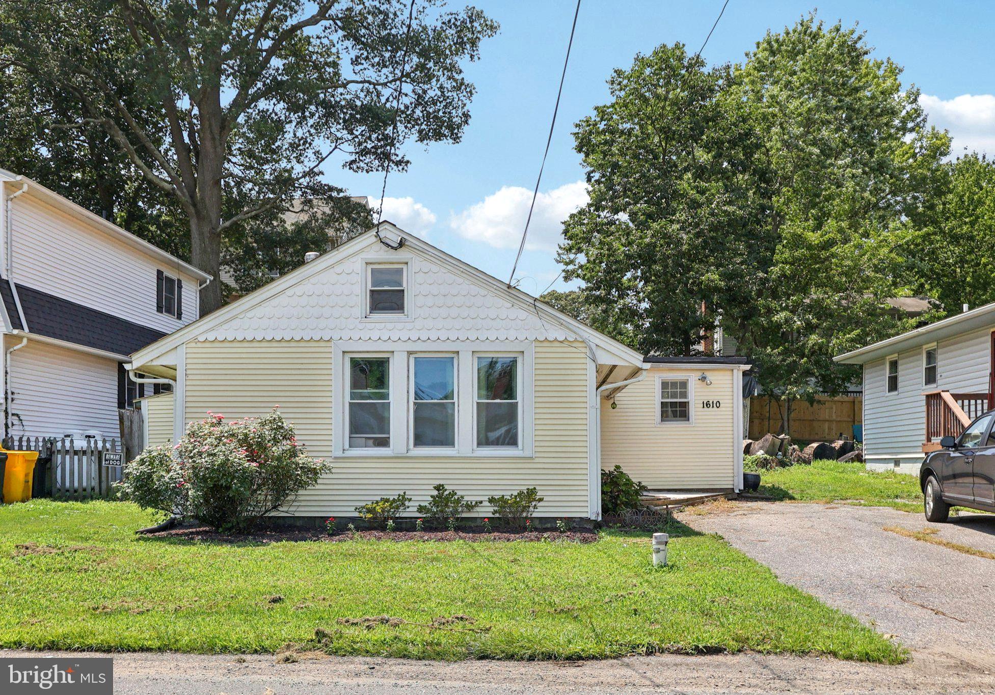 1610 Midland Road Edgewater, MD 21037 - Photo 1 of 27 a front view of a house with a yard