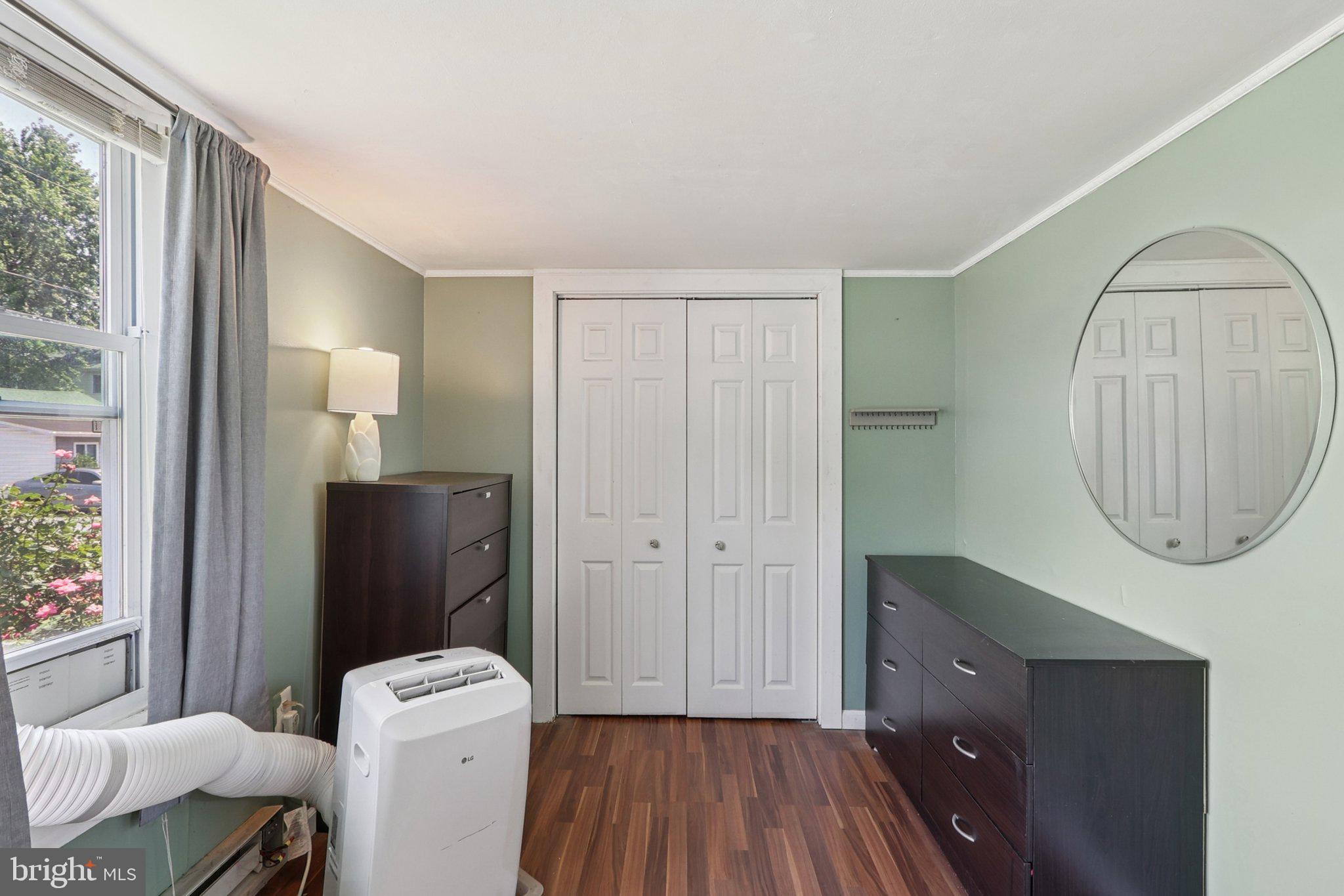 1610 Midland Road Edgewater, MD 21037 - Photo 14 of 27 a spacious bathroom with a toilet a sink and a mirror