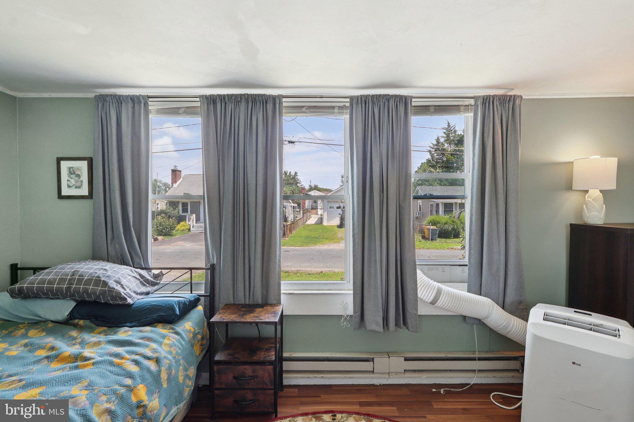 1610 Midland Road Edgewater, MD 21037 - Photo 15 of 27 a bedroom with a bed and a window