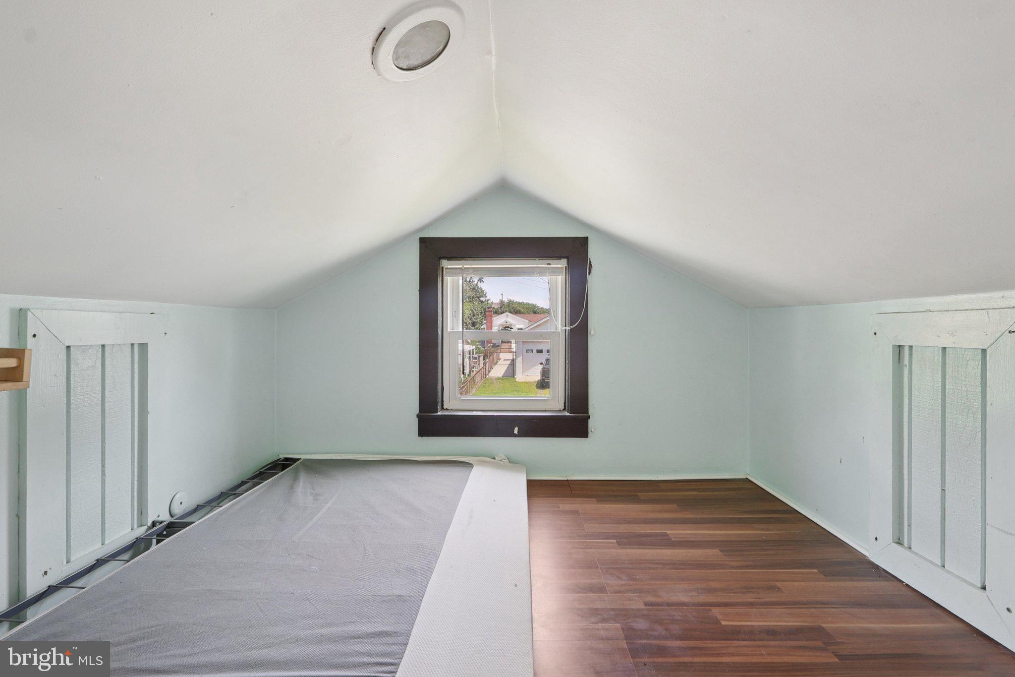1610 Midland Road Edgewater, MD 21037 - Photo 16 of 27 a view of an empty room with wooden floor and a window