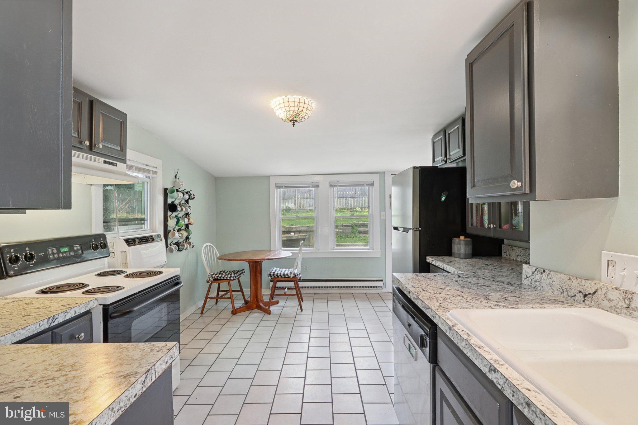 1610 Midland Road Edgewater, MD 21037 - Photo 6 of 27 a kitchen with stainless steel appliances granite countertop a sink stove and refrigerator