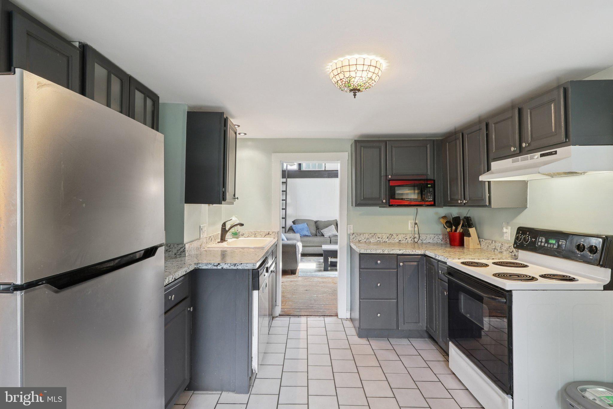 1610 Midland Road Edgewater, MD 21037 - Photo 7 of 27 a kitchen with a sink appliances and cabinets