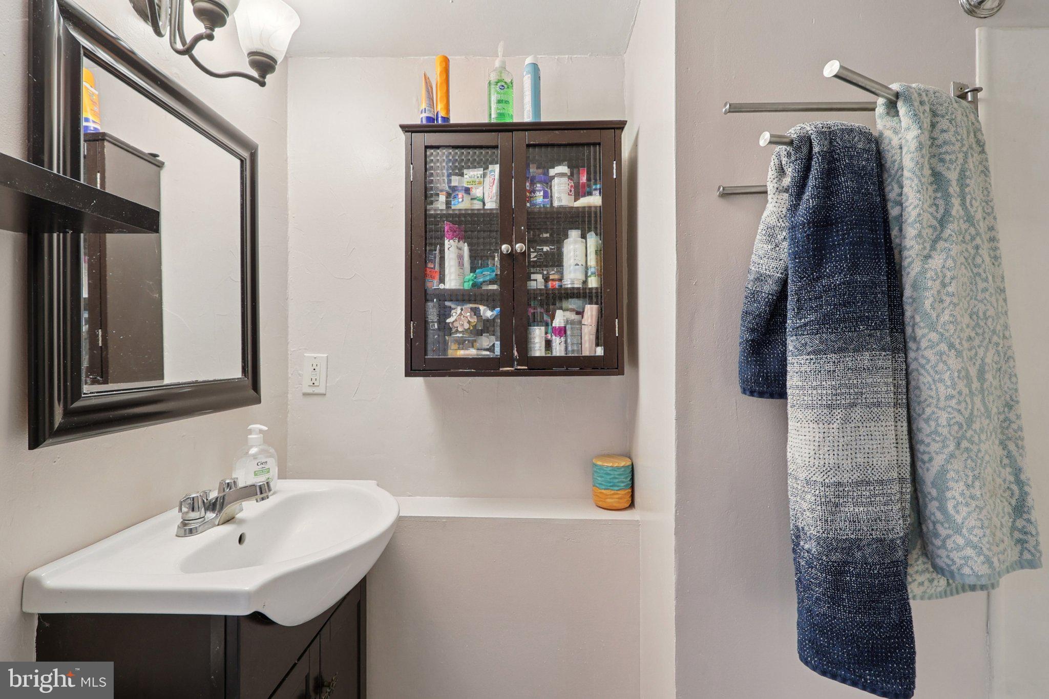 1610 Midland Road Edgewater, MD 21037 - Photo 9 of 27 a bathroom with a sink and a mirror