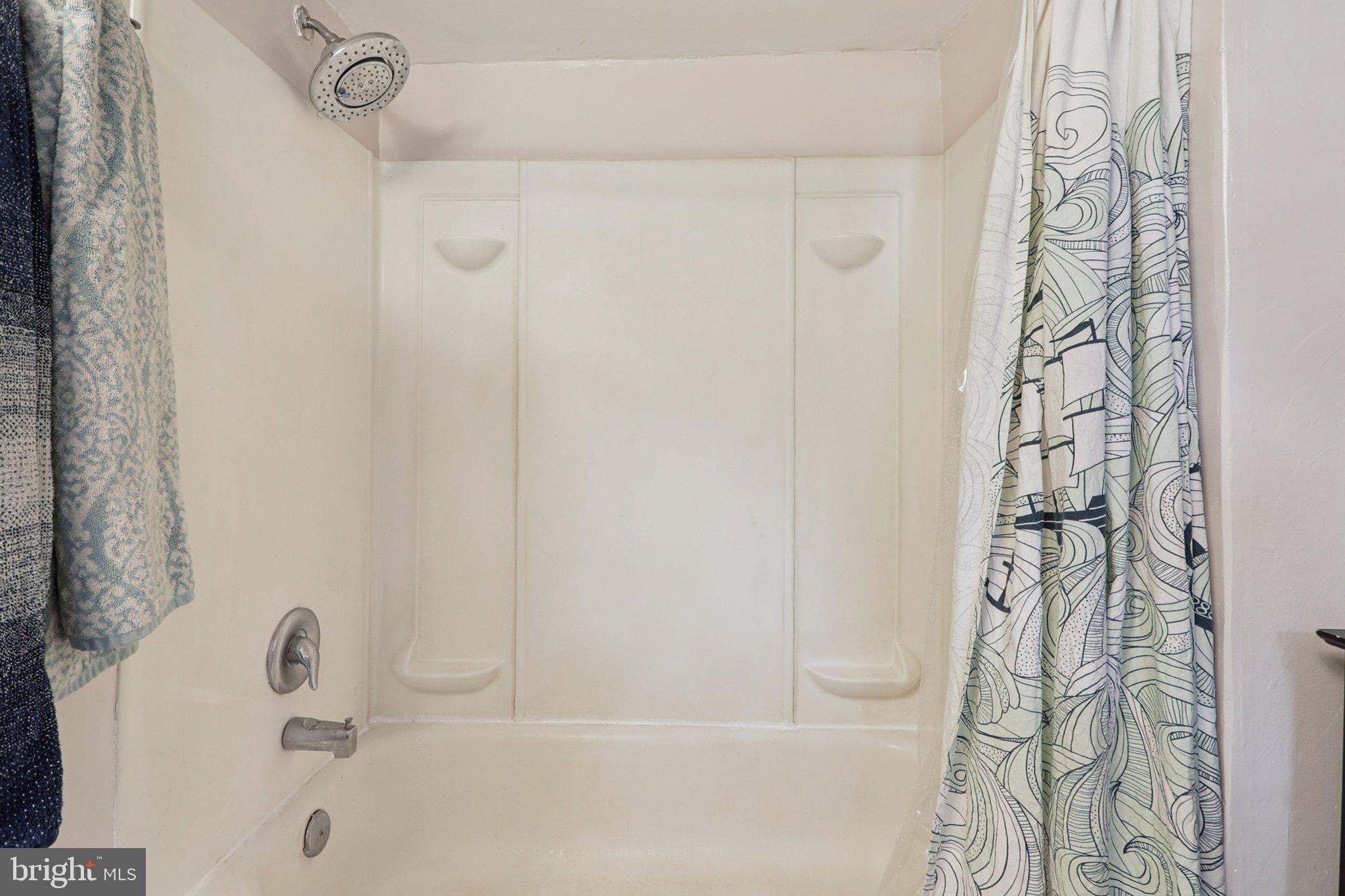 1610 Midland Road Edgewater, MD 21037 - Photo 10 of 27 a bathroom with a bathtub and shower