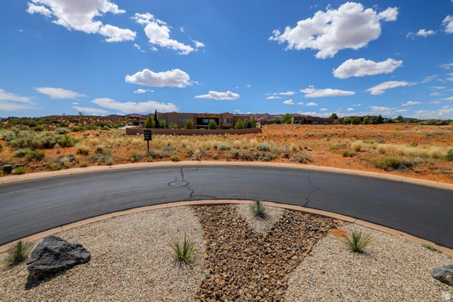 Basalt Cir Street, Unit 1027 St. George, UT 84770 - Photo 13 of 29 View of asphalt road featuring curbs