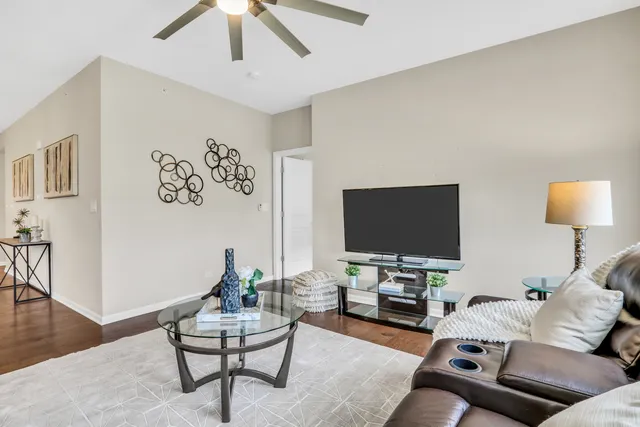 a living room with furniture and a flat screen tv
