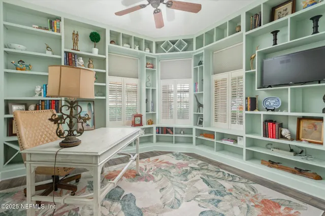 a room with furniture and a flat screen tv