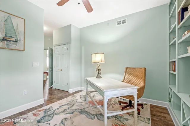 a view of a room that has a table and chairs in it