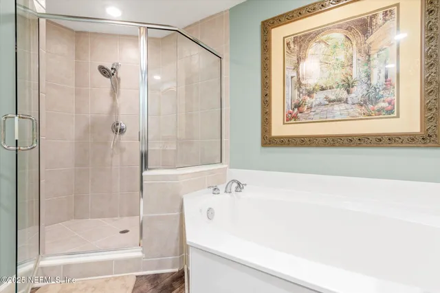 a bathroom with a shower and a bathtub