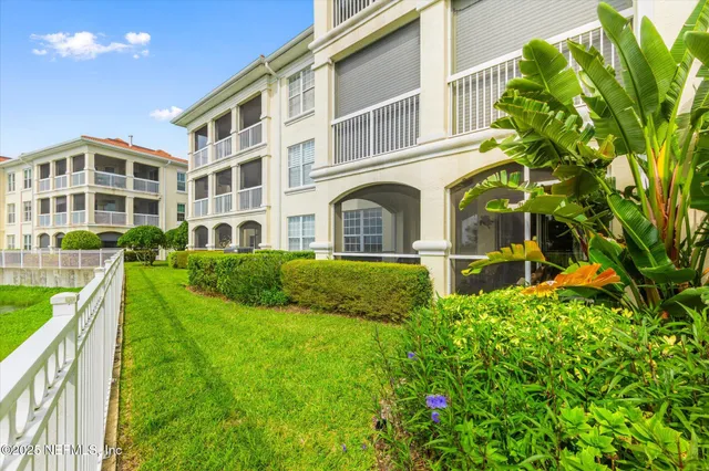 a view of a lake with a big yard
