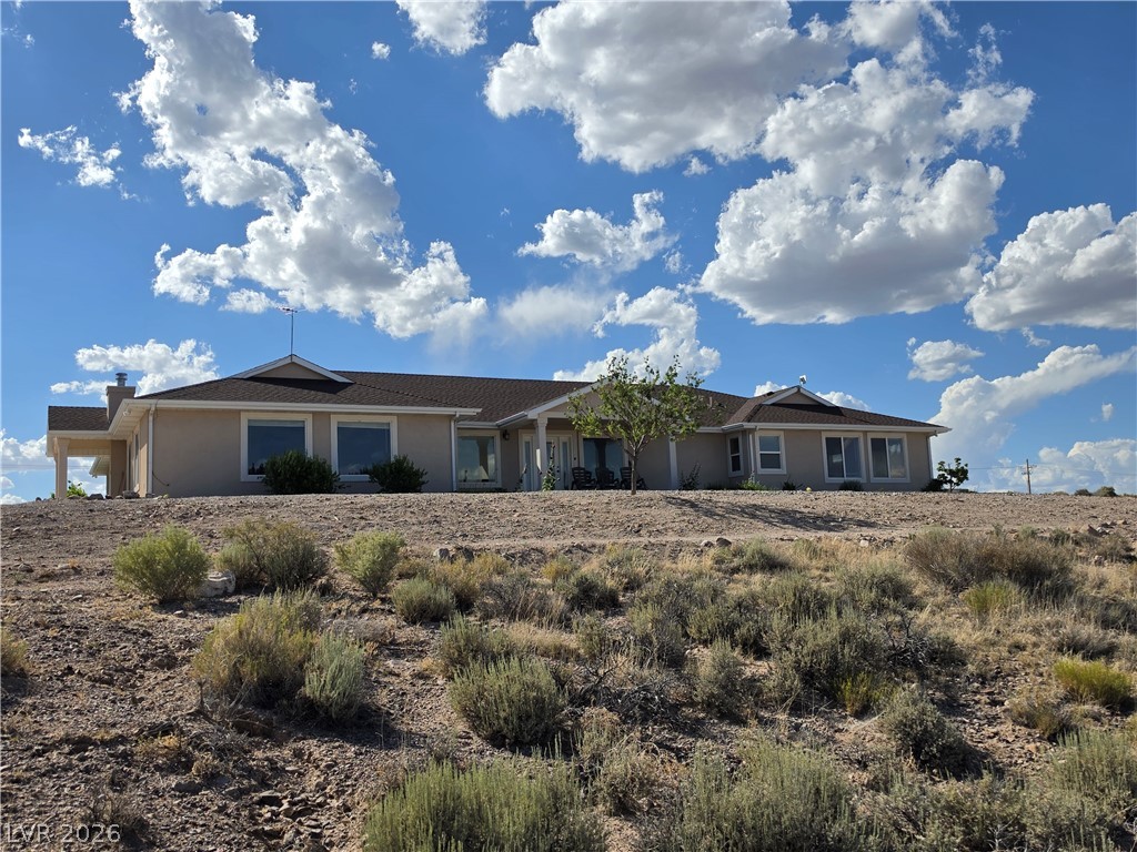 5272 Truman Lane Caliente, NV 89008 - Photo 33 of 43 Perched on a natural desert landscape, this home offers expansive views under vast open skies.