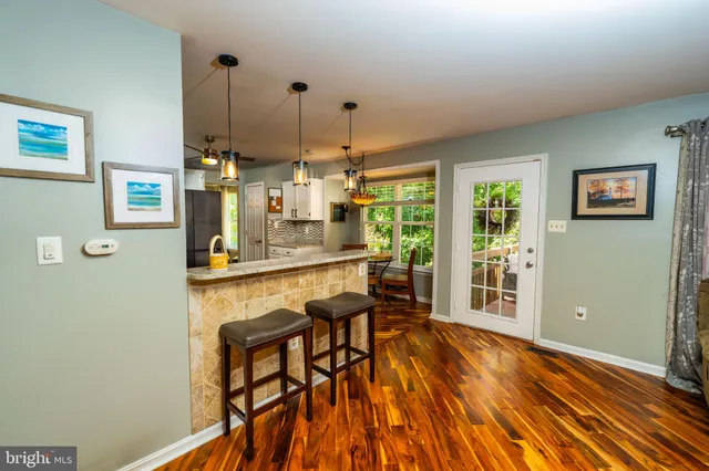 a view of dining room with furniture and window