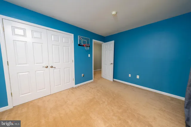 an empty room with closet area