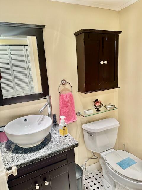 125 Suffolk C Boca Raton, FL 33434 - Photo 13 of 50 a bathroom with a granite countertop sink and a mirror