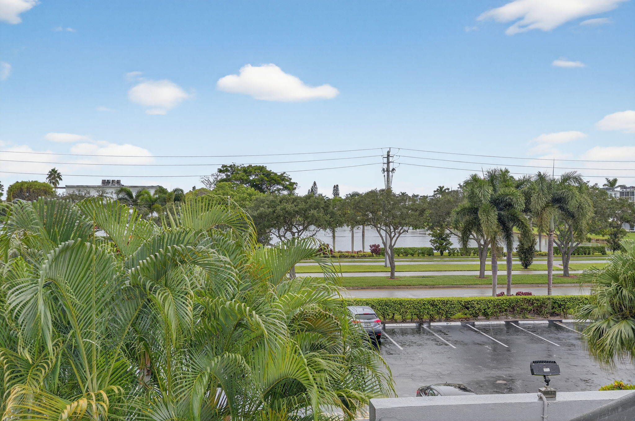 125 Suffolk C Boca Raton, FL 33434 - Photo 25 of 50 a view of a golf course with a lake
