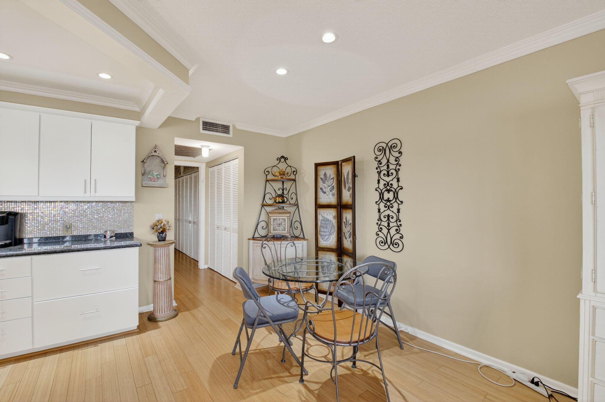 125 Suffolk C Boca Raton, FL 33434 - Photo 7 of 50 a view of a kitchen with furniture and wooden floor