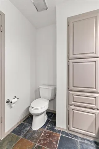 a bathroom with a toilet and a sink