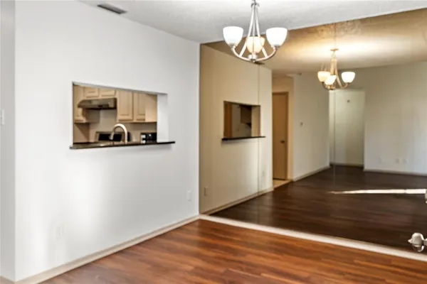 a view of a livingroom with wooden floor