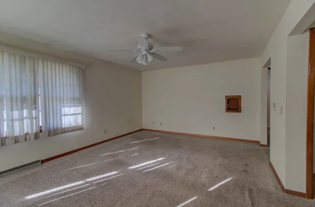 a view of an empty room with a window