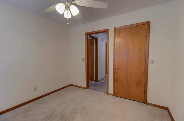 an empty room with a mirror