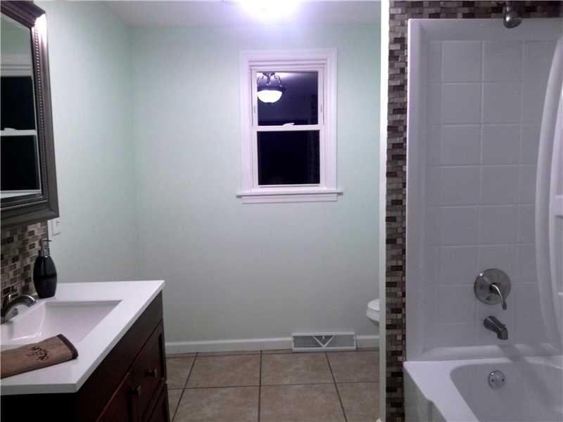 133 Klein Road New Brighton, PA 15066 - Photo 13 of 25 Master Bath/Spa. 1X08 FIRST FLOOR BATH WITH BEAUTIFUL GLASS TILEWORK AND PORCELIAN FLOORING.