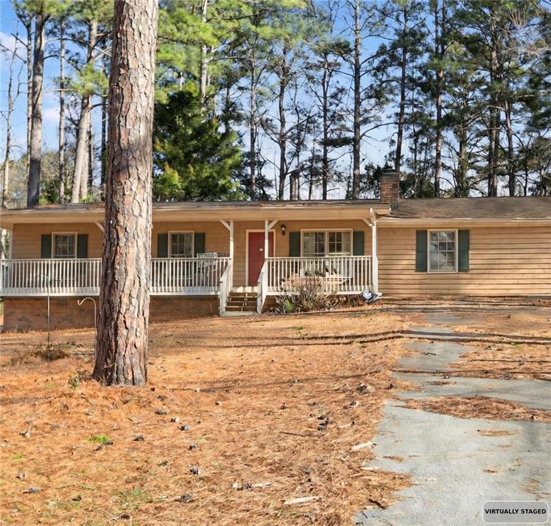 2373 Buckley Court Austell, GA 30106 - Photo 1 of 13 front view of a house with a big yard