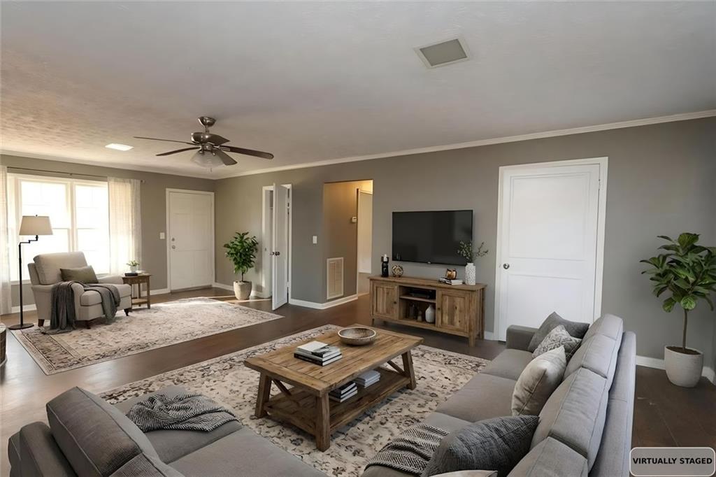 2373 Buckley Court Austell, GA 30106 - Photo 5 of 13 a living room with furniture a flat screen tv and a large window
