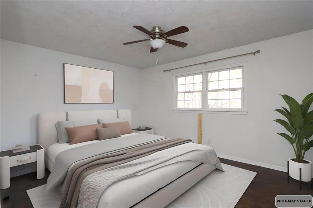 2373 Buckley Court Austell, GA 30106 - Photo 7 of 13 a bedroom with bed window and bed