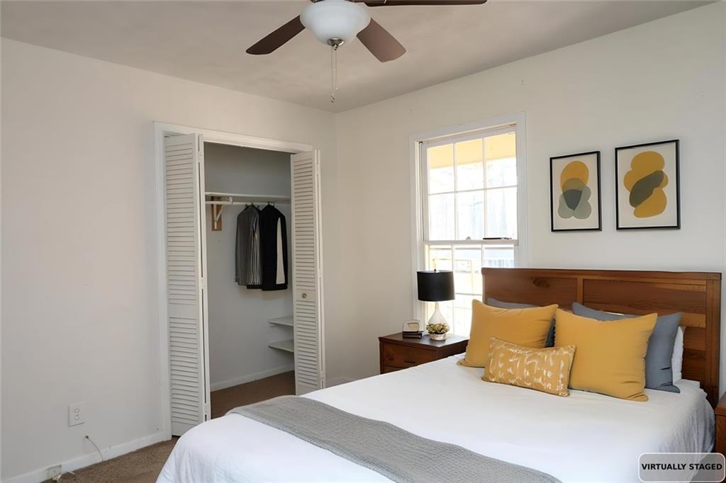 2373 Buckley Court Austell, GA 30106 - Photo 8 of 13 a bedroom with a bed and a painting on the wall