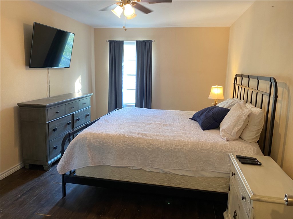 196 East Lakeview Trail Sandia, TX 78383 - Photo 13 of 39 a bedroom with a bed and flat screen tv