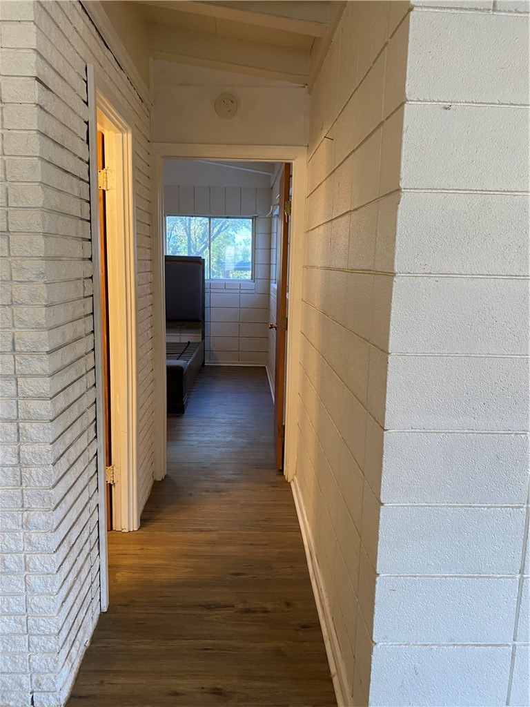 196 East Lakeview Trail Sandia, TX 78383 - Photo 25 of 39 a view of a hallway with wooden floor and staircase