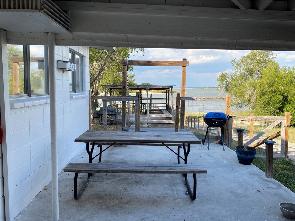 196 East Lakeview Trail Sandia, TX 78383 - Photo 26 of 39 a view of a patio with a table chairs and a potted plant
