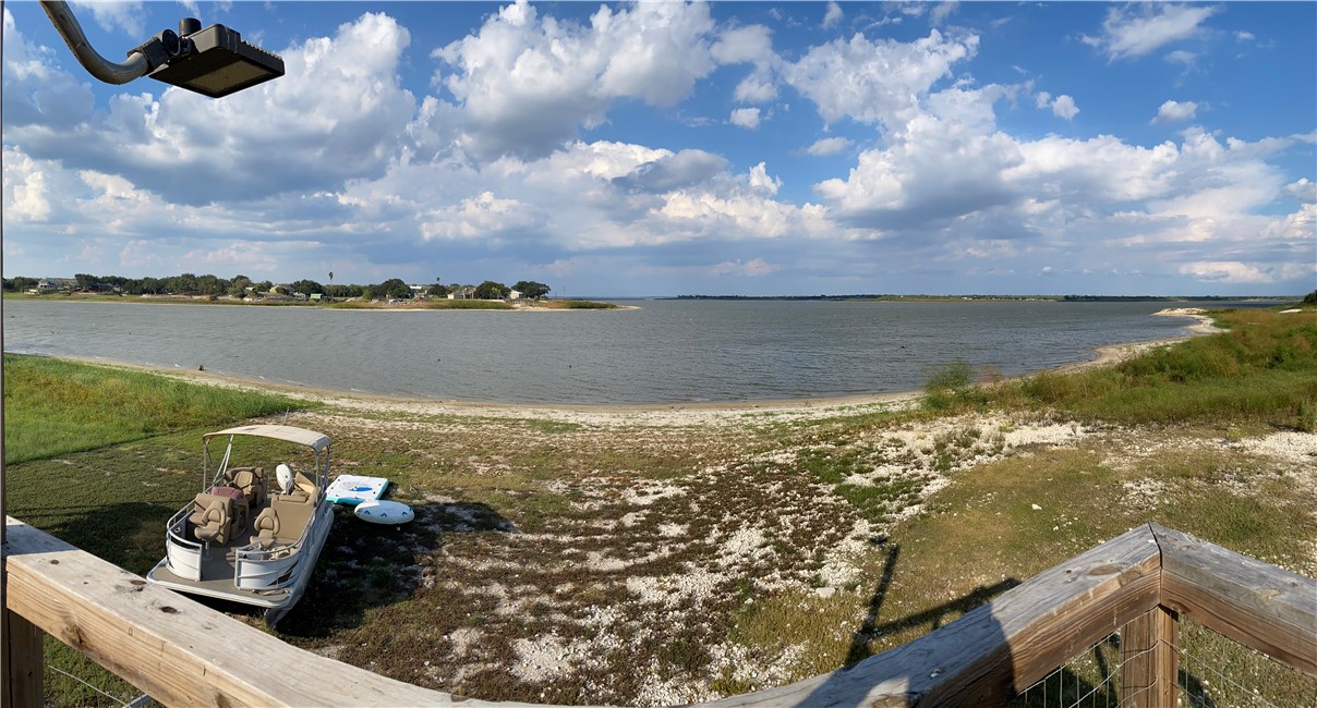 196 East Lakeview Trail Sandia, TX 78383 - Photo 28 of 39 a view of a lake from a yard