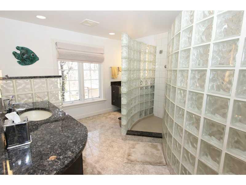 302 McKenzie Road Clinton, PA 15026 - Photo 14 of 23 Master Bath/Spa. BEAUTIFUL MASTER BATH WITH PORCELAIN TILE FLOORING. VERY LARGE WALK-IN-SHOWER WITH GLASS BLOCK WALLS. GRANITE COUNTER TOP. GROHE & KOHLER BATHROOM FIXTURES IN EACH BATH.