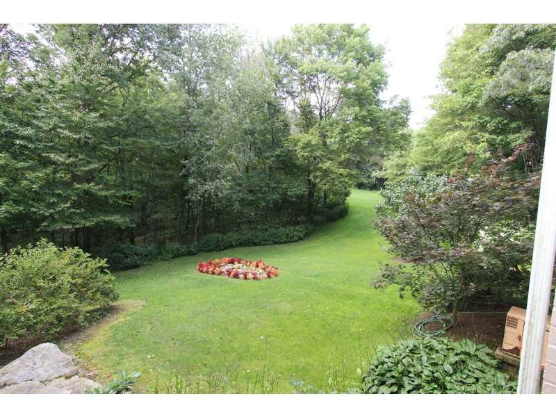302 McKenzie Road Clinton, PA 15026 - Photo 20 of 23 Yard/Garden. SIDE YARD, MATURE TREES. VERY PRIVATE. HOME HAS A STATIONARY GENERATOR SYSTEM ON SIDE EXTERIOR OF HOME.
