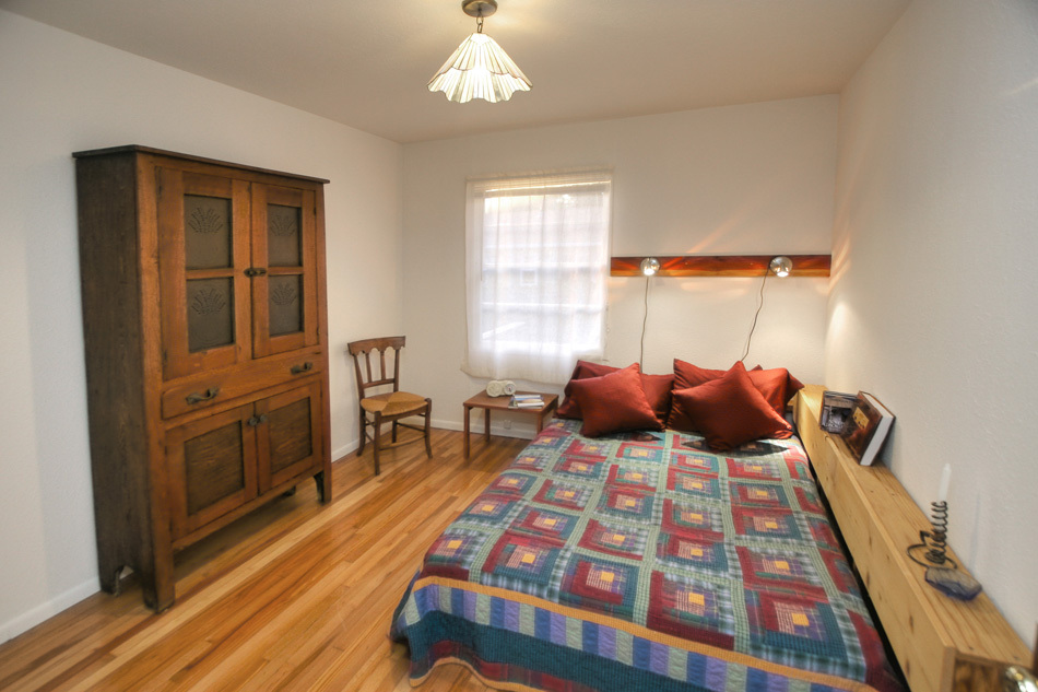 1064 Cheltenham Road Santa Barbara, CA 93105 - Photo 12 of 15 a bedroom with a bed and wooden floor