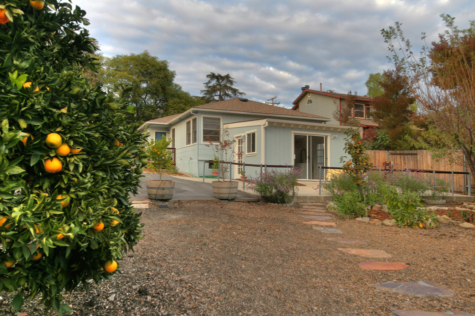 1064 Cheltenham Road Santa Barbara, CA 93105 - Photo 3 of 15 a view of a house with a yard and plants