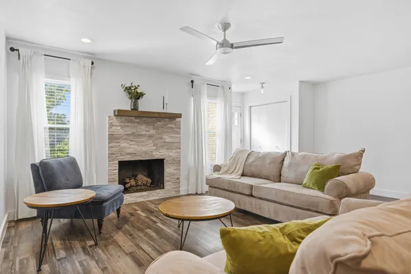 a living room with furniture and a fireplace