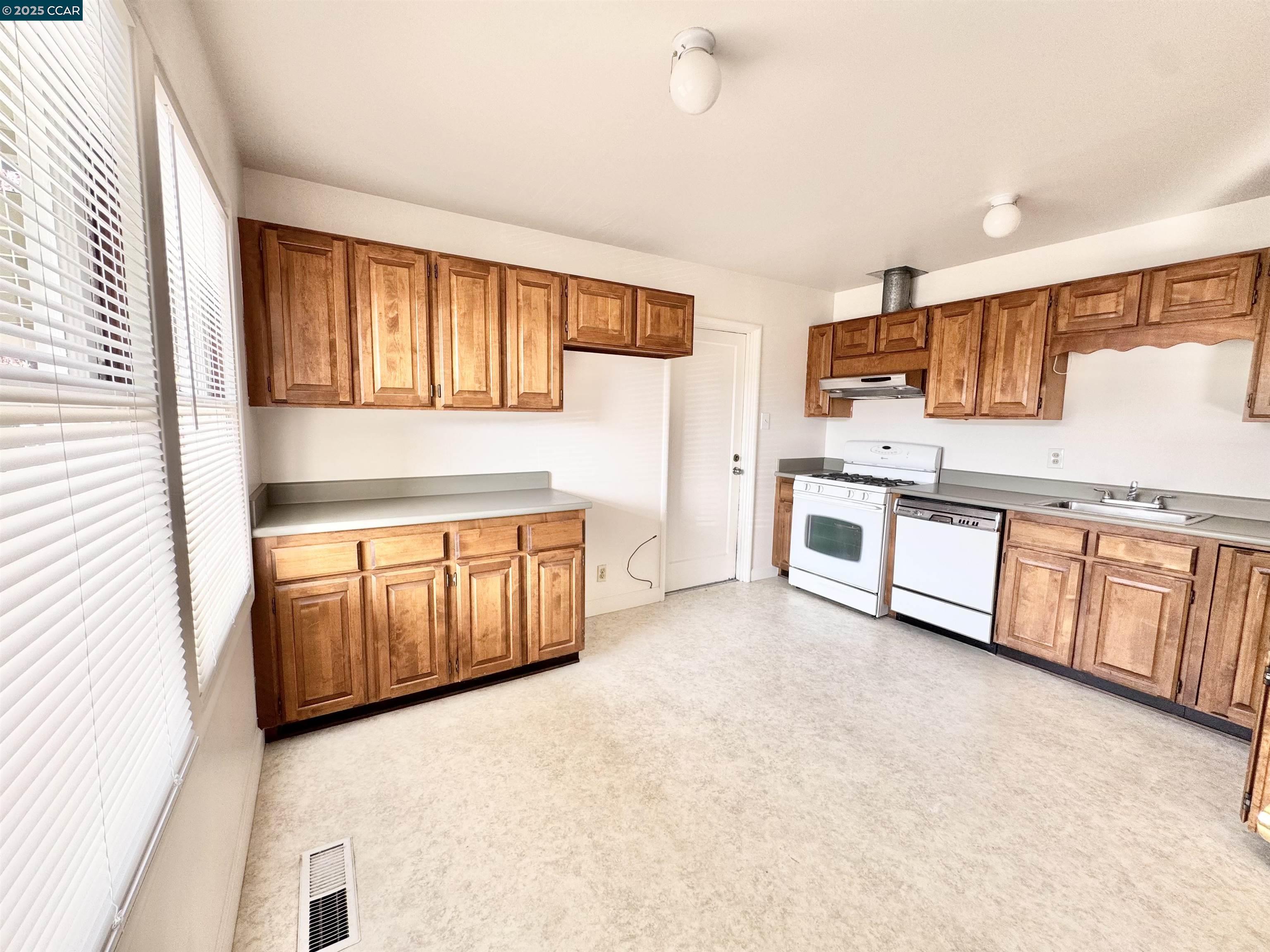 1834 Venice Drive Concord, CA 94519 - Photo 14 of 25 a view of a kitchen with stainless steel appliances granite countertop a stove and a refrigerator